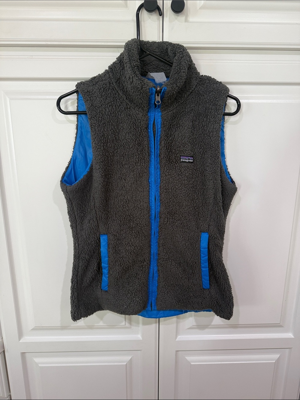 Patagonia Charcoal Sherpa Vest with Bright Blue Accents
